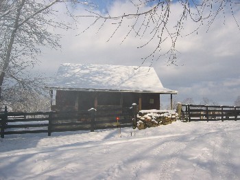 Barn on a misty, snowy morning.